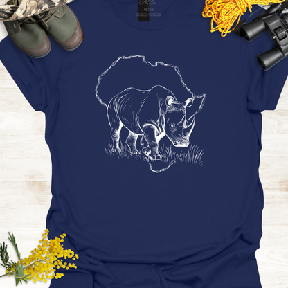 Navy blue t-shirt with a white rhinoceros graphic on a wooden surface with camouflage boots, yellow flowers, and binoculars.