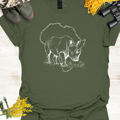 Green t-shirt with a rhino graphic on a wooden surface with boots, binoculars, and yellow flowers.